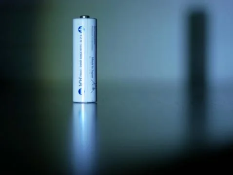 AA alkaline batteries close up on a table Stock Photos