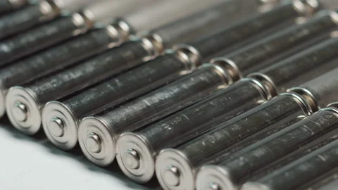 AA batteries background closeup pan slide Vídeos de archivo 171415213