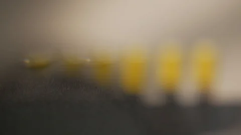 AA battery next to the power. Look through a magnifying glass Stock Footage 123818014