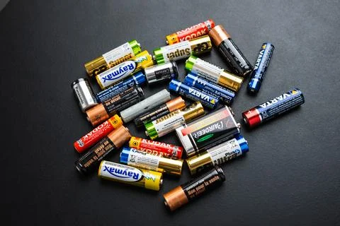 AAA, AA, CR2, 9 Volt used alkaline batteries on the black table Stock Photos