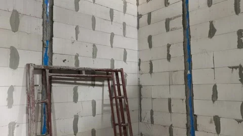AAC Block Wall Construction with Metal Stiffener and Lintel Stock Footage 342479665