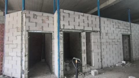 AAC Block Wall Construction with Metal Stiffener and Lintel Stock Footage 342479714