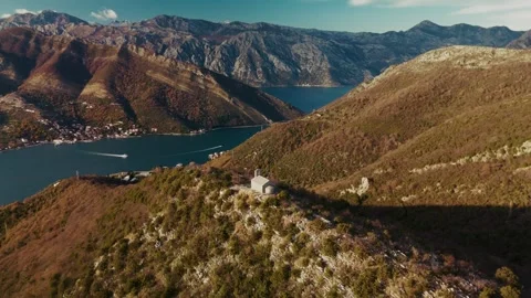 Aaerial view of Boka bay with a small church on the top of the mountain in Stock Footage 313733373