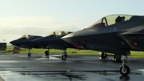 Aalborg, Denmark - September 13, 2026: Three F-35 fighter jets parked Stock Footage 345590791