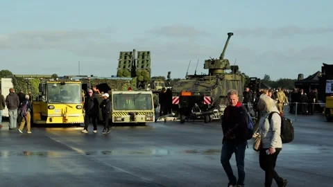 Aalborg, Denmark - September 13, 2026: Visitors observing military vehicles Stock Footage 345590892