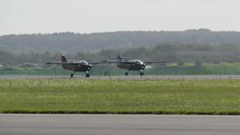 Aalborg, Denmark - September 13, 2026: Two black propeller airplanes taxiing Stock Footage 345591435