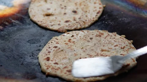 Aaloo Paratha in the Process of making around the Street of Delhi Stock-Footage 254806849
