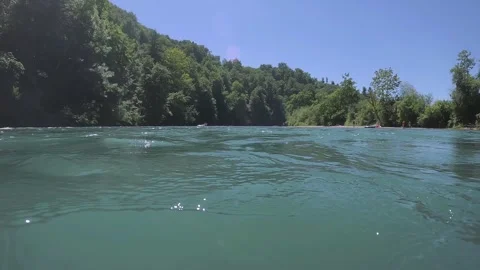 Aare bustle around the Bremgarten loop, people on the beach, boat, Bern city, Stock Footage 337376518