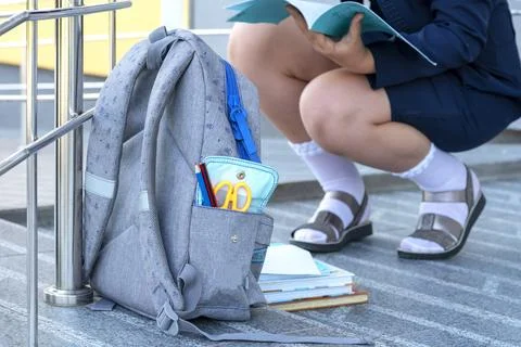 Abackpack. pupil, learner, scholar. A student holds a books and notebooks Stock Photos