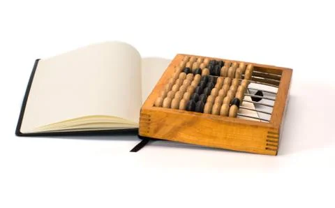 Abacus and notebook. Stock Photos