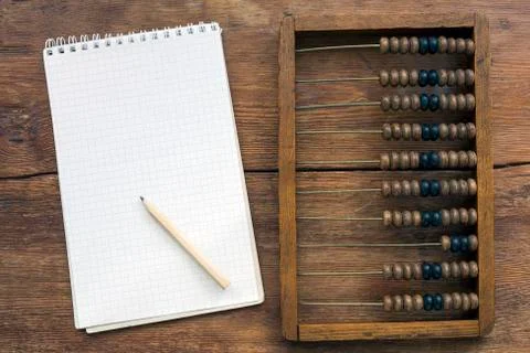Abacus and notes Stock Photos