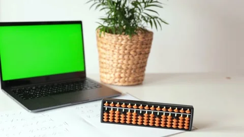 Abacus for mental arithmetic on a table with a laptop , nobody. The concept of l Stock Footage 239626148