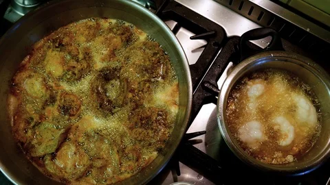 Abalone and crayfish (seafood) being fried on gas stove. Stock Footage 104711945
