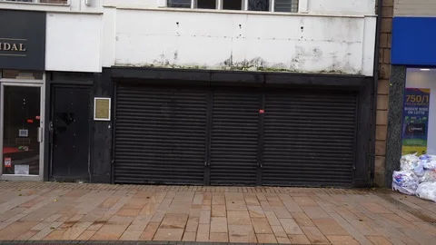 Abandoned and empty shops in the city centre due to high street decline Stock Footage 122589572