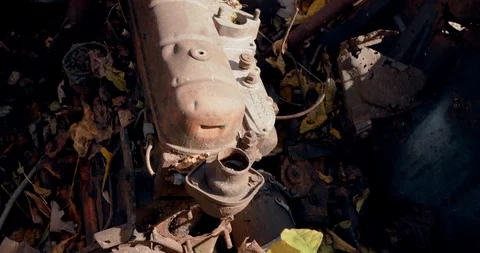 Abandoned Antique Car Engine in Forest - Old and Rusted Stock Footage 119000902