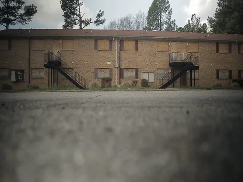 ABANDONED APARTMENT BUILDING LOW ANGLE Stock Footage 75686471