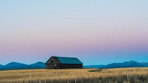 Abandoned barn in a field. Stock Photos