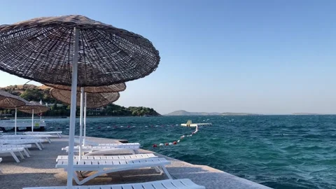 Abandoned Beach at the End of Summer with Slow Motion Waves Stockbeeldmateriaal 251239964