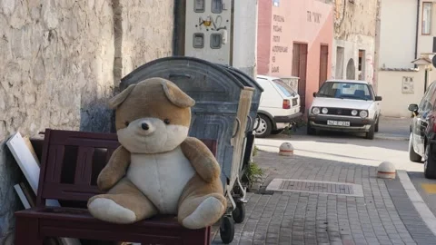 Abandoned Big Teddy Bear Thrown in the Garbage Symbol of Leaving Childhood 動画素材 234296959