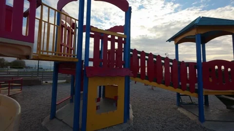 Abandoned Bouncy Castle in Empty Playground at Dusk Vídeo Stock 303399275