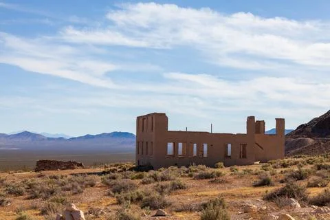 Abandoned brick ruins with empty window openings and mountain views across .. Photos