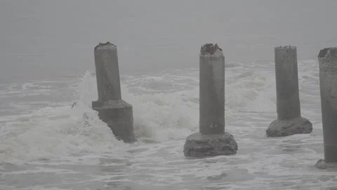 Abandoned Bridge Pillar Standing Alone in the Middle of the Ocean  S-Log3 Video stock 313092332