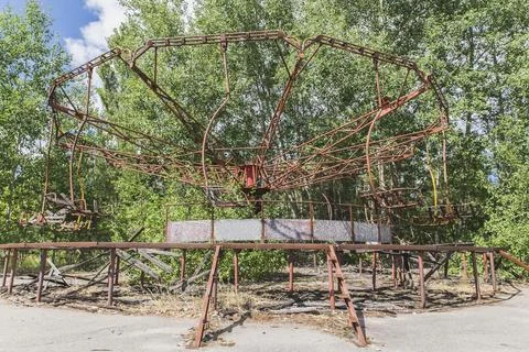 Abandoned broken rusty carousel in Pripyat Ukraine Stock Photos