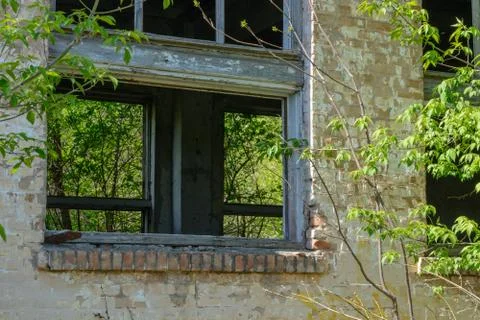 An abandoned building a broken window Stock Photos