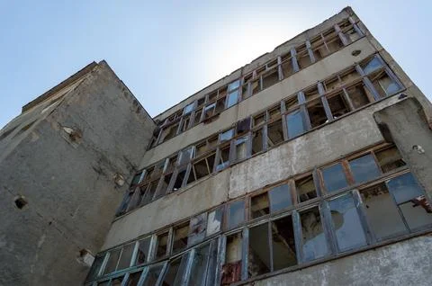 Abandoned building with broken windows Stock Photos