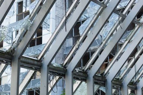 Abandoned building construction with smashed windows Stock Photos