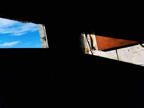 Abandoned Building with Dramatic Light and Shadow 스톡 사진