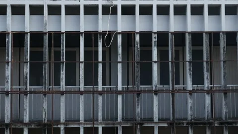 Abandoned building exterior with large grid windows 動画素材 334413146