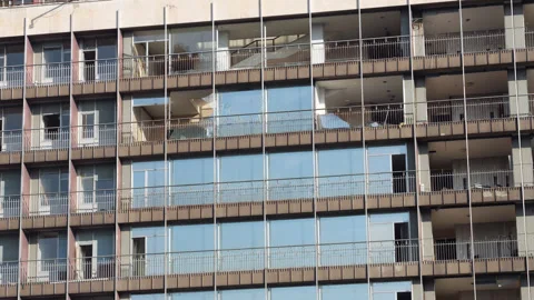 Abandoned building facade with broken windows, glass fall down 스톡 동영상 320242138