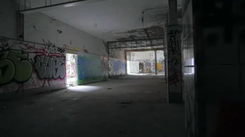 Into an abandoned building full of graffiti Stock Footage 58482579