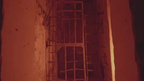 An abandoned building. the gate door opens and closes by itself. the concept of Stock Footage 234193643