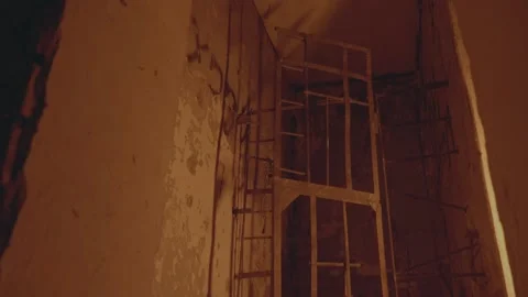 An abandoned building. the gate door opens and closes by itself. the concept of Stock Footage 238661596