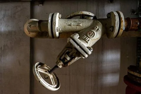  Abandoned Building Interior Central heating installation with taps and pi... Fotos de archivo