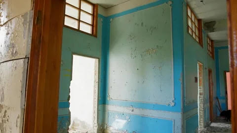 Abandoned building interior with deteriorating walls, peeling paint, wooden Video stock 342087577