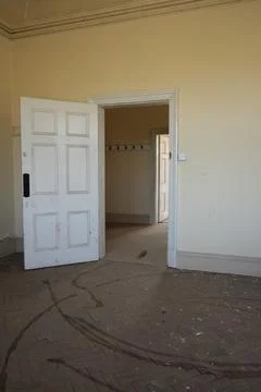 Abandoned Building Interior With Open Doors, Dirty Floor, Bulcote, England Stock Photos