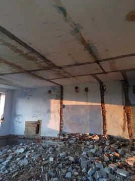 Abandoned building place without windows in evening light of sunset Stock Photos