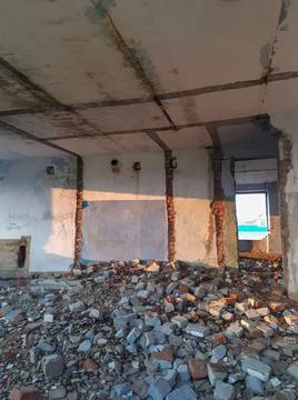Abandoned building place without windows in evening light of sunset Stock Photos