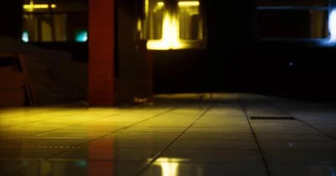 Abandoned building with reflections on tiled floor illuminated by lights Ilustración de archivo