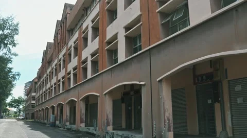 Abandoned building standing in empty city, urban decay documentary Stockbeeldmateriaal 334229787