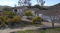Abandoned buildings with river, rocks and dry hills landscape at Mértola Prt 4k or 4k+ Resolution