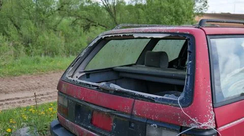 Abandoned Car with Broken Rear Window Stock Photos