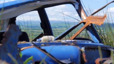 Abandoned Car on Hillside Stock Footage 97854767