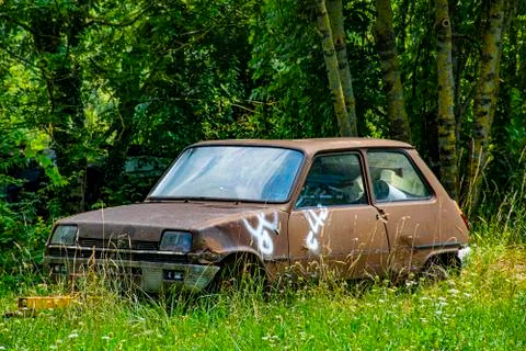 Abandoned car in the nature Stock Photos