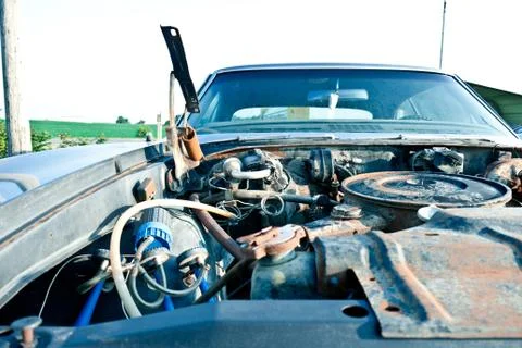 Abandoned car with rusted engine Stock Photos