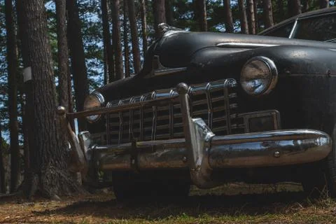 Abandoned Car Rusting in the Woods Close Up Stock Photos