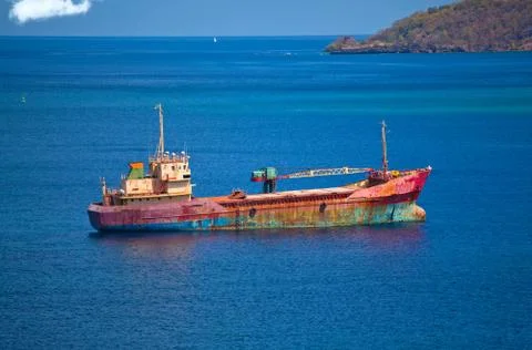 Abandoned cargo ship in the ocean Stock Photos
